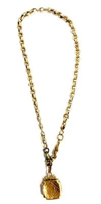 necklace with a gold chain and a gold coin on a white background