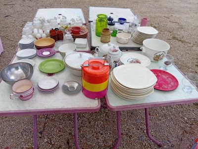 a table that has many plates and bowls on it
