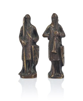 pair of bronze figurines of a man and a woman