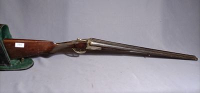 an old gun with a wooden handle on a white background