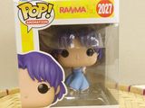 a close up of a pop vinyl figure in a box on a table