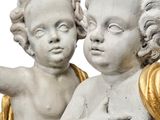 two statues of cherenshes holding hands together