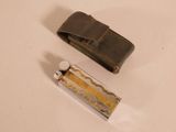 a lighter and a lighter case sitting on a table