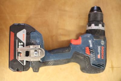 a cordless tool that is sitting on a table