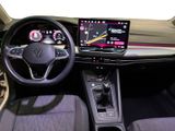 the interior of a car with a steering wheel, dashboard, and display screen