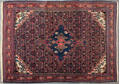 Tapis Iran à décor d'un médaillon central dans les tons bleu…