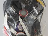 a bag of assorted items in it on a table