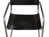 a black leather chair with chrome legs and a black leather seat