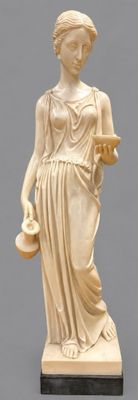 statue of a woman holding a pitcher and a bowl