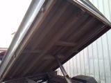 a truck that has a flat bed on the back of it
