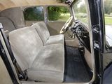 a view of the inside of a car from the driver ' s seat