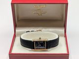 an image of a watch in a box on a white surface