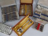 many different types of silverware in a box