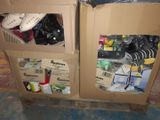 two cardboard boxes with shoes in them on the floor