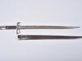 pair of silver plated knives on white surface with white background