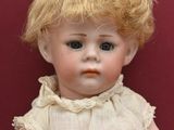 a small doll that is sitting on a table