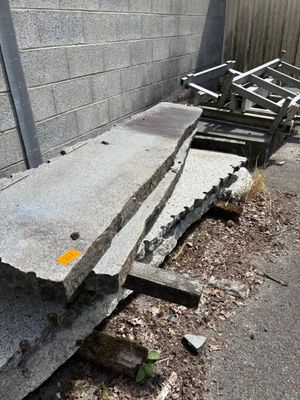 a pile of concrete blocks sitting on the side of a building