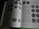 a book open on a table with a bunch of circles on it