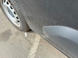 a close up of a car ' s tire on the street