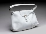 an image of a white purse on a gray background
