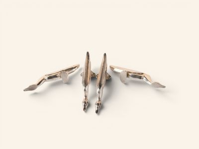 silver and gold plated cufflinks with a bird design
