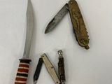 several different types of knives on a white surface