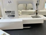 a sewing machine sitting on a table in a room