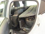 a car with luggage in the back seat of it