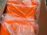 a box full of orange boxes sitting on the ground
