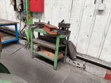 a machine that is sitting on a table in a garage