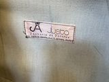 the back of a jacket with a label on it