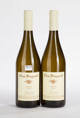 two bottles of wine sitting next to each other on a white surface