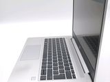a close up of a laptop computer on a white surface