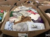 many boxes full of clothes and other items in the store