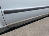 a close up of a car door handle on the side of the car