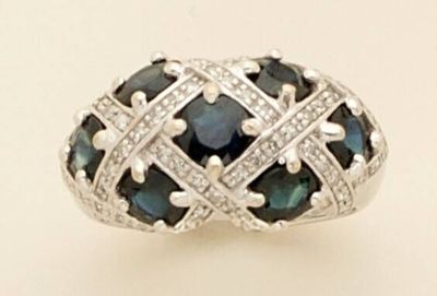 an image of a ring with blue and white diamonds on it