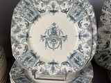 many plates stacked on top of each other on a table