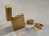 a gold lighter that is sitting next to other lighters