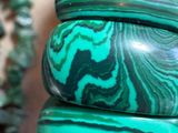 three green marbled bangles stacked on top of each other