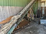 a pile of junk in a warehouse with a green wall