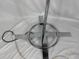 a lamp that is sitting on a white sheet
