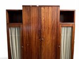 an image of a wooden cabinet with curtains on it