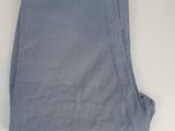 a close up of a pair of blue pants hanging on a wall