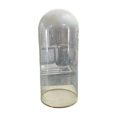 a glass case with a clock inside of it