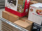 a shopping cart with a bunch of boxes on top of it