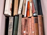 a box full of old books sitting on a table