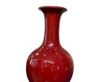 an image of a red vase on a white background