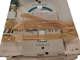 a stack of boxes that are wrapped up and stacked on top of each other
