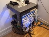 a rack of wires in the corner of a room