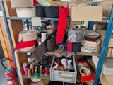many rolls of tape on a shelf in a room